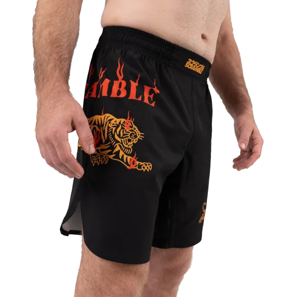 Pair of Scramble Burning Tiger Shorts hanging against a neutral background