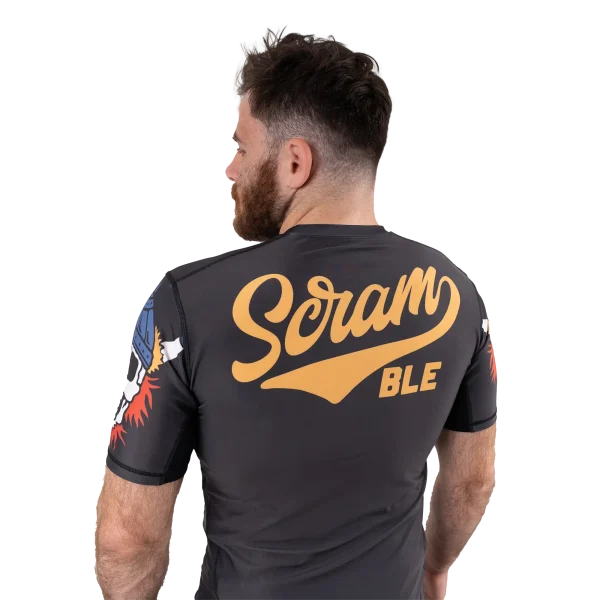 Man wearing Scramble Viking Rashguard with intricate Norse designs