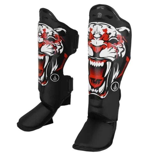 Close-up view of TUFF Muay Thai Shin Guard Pads with Tiger design