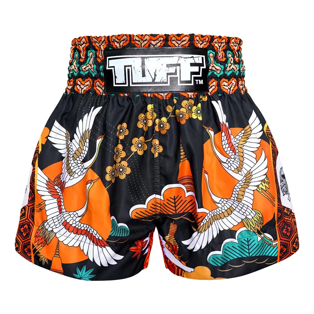 A person wearing TUFF Muay Thai Shorts Autumn Sunray MS652