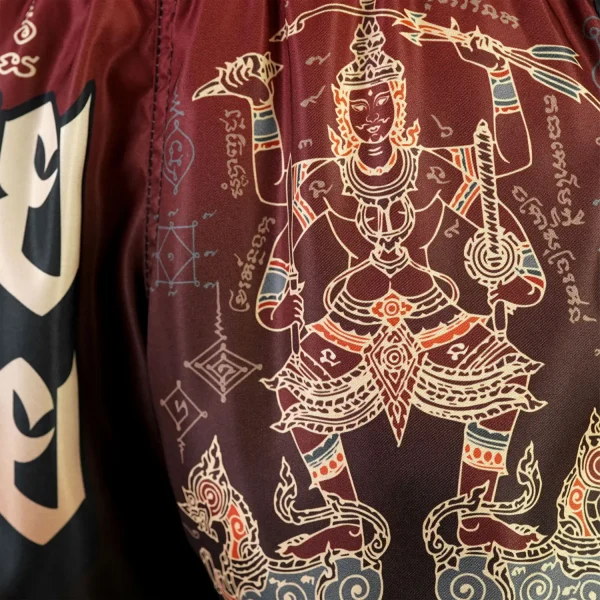 Close up view of TUFF Muay Thai Shorts New Retro Style Yant Narai Turning the Land MSC101