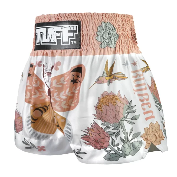 Black and golden TUFF Muay Thai Shorts The Origin of Hope MS678 on a white background.