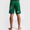 Man wearing Venum x UFC Fusion Authentic Fight Night Men’s Fight Shorts - Long Fit