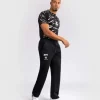 Man wearing Venum x UFC Fusion Authentic Fight Night Men's Straight Leg Walkout Jogger Pants