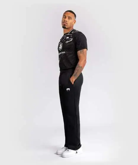 Man modeling Venum x UFC Fusion Authentic Fight Night Men's Straight Leg Walkout Jogger Pants.