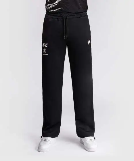 Man wearing Venum x UFC Fusion Authentic Fight Night Men's Straight Leg Walkout Jogger Pants
