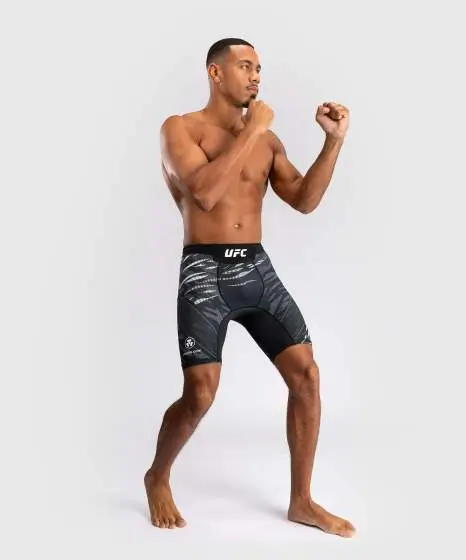 Man wearing Venum x UFC Fusion Authentic Fight Night Men's Vale Tudo Compression Shorts