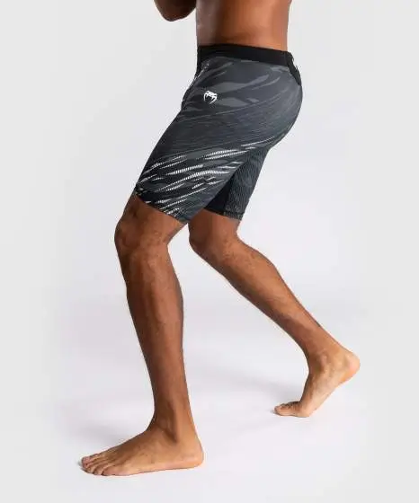 Man wearing Venum x UFC Fusion Authentic Fight Night Men's Vale Tudo Compression Shorts