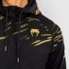 Man wearing a Venum x UFC Fusion Authentic Fight Night Men's Walkout Hoodie.