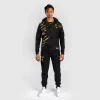 Man wearing Venum x UFC Fusion Authentic Fight Night Men's Walkout Hoodie