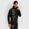 Man wearing Venum x UFC Fusion Authentic Fight Night Men's Walkout Hoodie