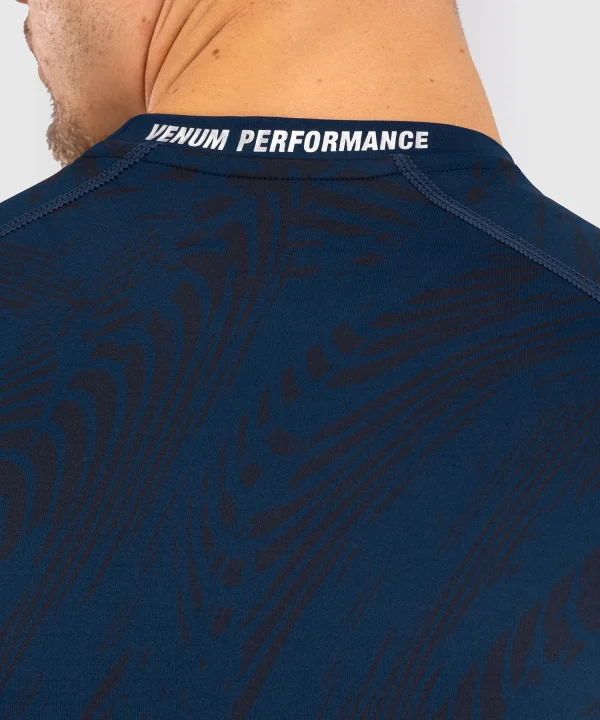 Man posing in a Venum x UFC Fusion Fight Week Long Sleeve Rashguard