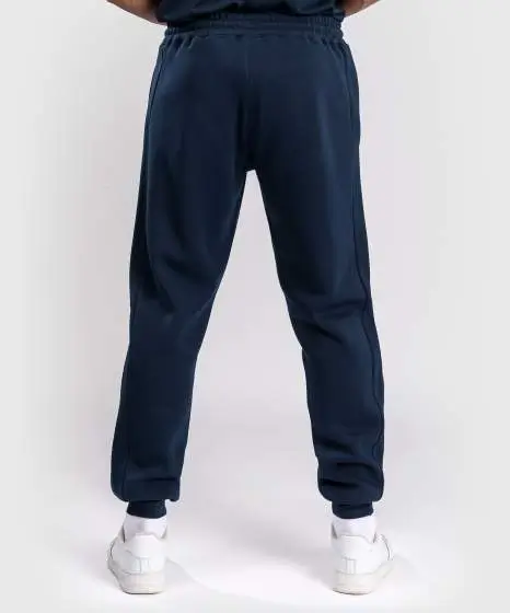A man wearing Venum x UFC Fusion Fight Week Men's Cotton Solid Jogger Pants