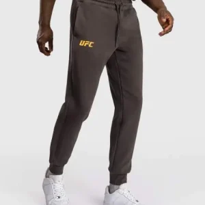 Venum X Ufc Fusion Fight Week Mens Cotton Solid Jogger Pants Brown 4 Man wearing Venum x UFC Fusion Fight Week Men's Cotton Solid Jogger Pants.