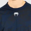 Man wearing a long-sleeve Venum x UFC Fusion Fight Week t-shirt