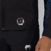 Venum X Ufc Fusion Fight Week Mens Zip Hoodie Blue 3 Man modeling the Venum x UFC Fusion Fight Week Men's Zip Hoodie.