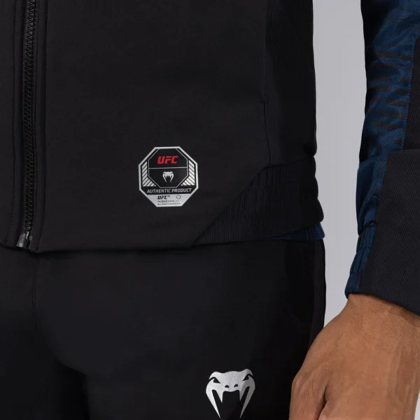 Venum X Ufc Fusion Fight Week Mens Zip Hoodie Blue 3 Man modeling the Venum x UFC Fusion Fight Week Men's Zip Hoodie.