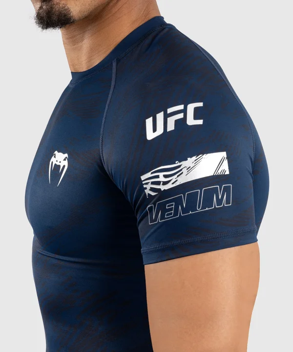 Man wearing Venum x UFC Fusion Men's Fight Week Performance Short Sleeve Rashguard