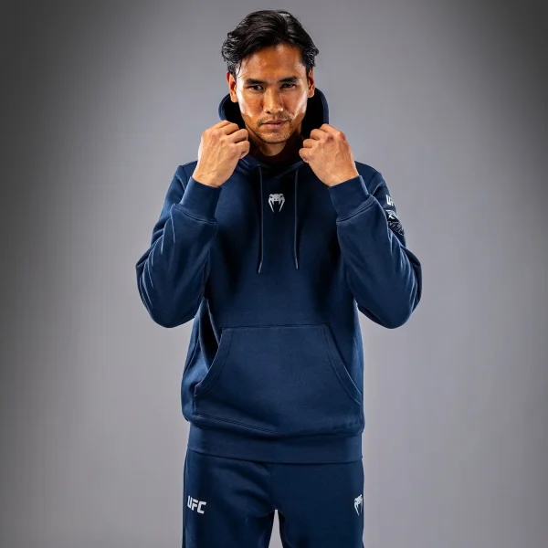 Venum X Ufc Fusion Mens Fight Week Pullover Solid Hoodie Blue 1 Man wearing a Venum x UFC Fusion Men's Fight Week Pullover Solid Hoodie