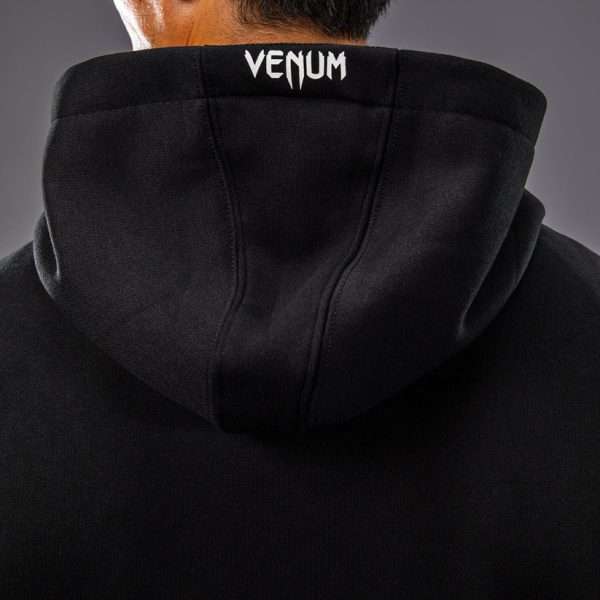 Man wearing Venum x UFC Fusion Men's Replica Zip Hoodie