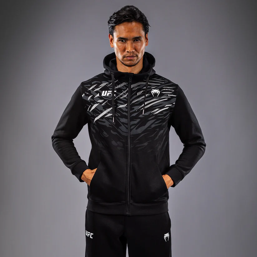 Venum x UFC Fusion Men's Zip Hoodie Model wearing Venum x UFC Fusion Men's Replica Zip Hoodie