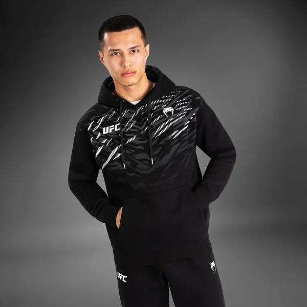 Venum X Ufc Fusion Replica Mens Pullover Hoodie Black 5 Man wearing the Venum x UFC Fusion Replica Men's Pullover Hoodie