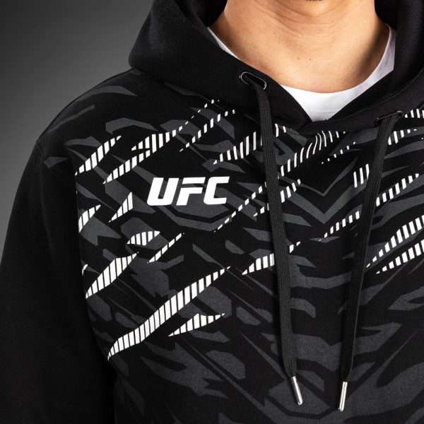 Venum X Ufc Fusion Replica Mens Pullover Hoodie Black 7 Man wearing the Venum x UFC Fusion Replica Men's Pullover Hoodie