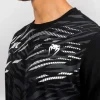 Man modeling the Venum x UFC Fusion Replica Men's Short Sleeve T-Shirt.