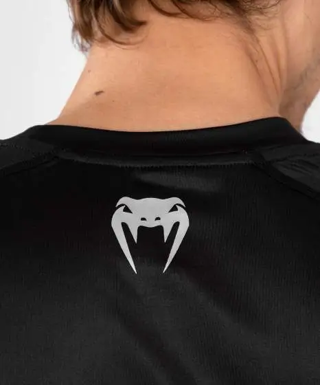 Man wearing Venum x UFC Performance Institute 2.0 Men's Dry-Tech T-Shirt