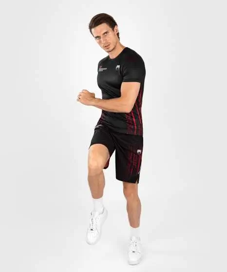 Man wearing Venum x UFC Performance Institute 2.0 Men's Short Sleeve Rashguard
