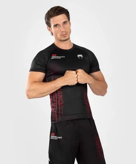 Man wearing the Venum x UFC Performance Institute 2.0 Men's Short Sleeve Rashguard