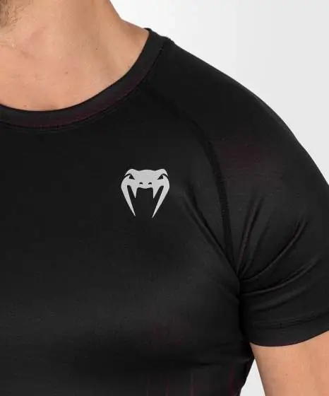 Man wearing Venum x UFC Performance Institute 2.0 Men's Short Sleeve Rashguard