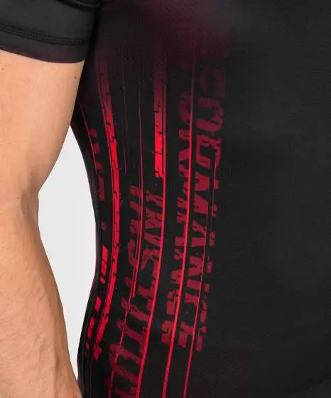 Man wearing Venum x UFC Performance Institute 2.0 Men's Short Sleeve Rashguard