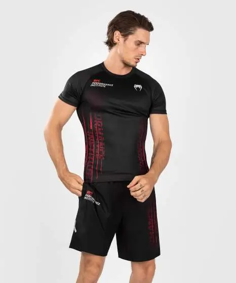 Man wearing Venum x UFC Performance Institute 2.0 Men's Short Sleeve Rashguard