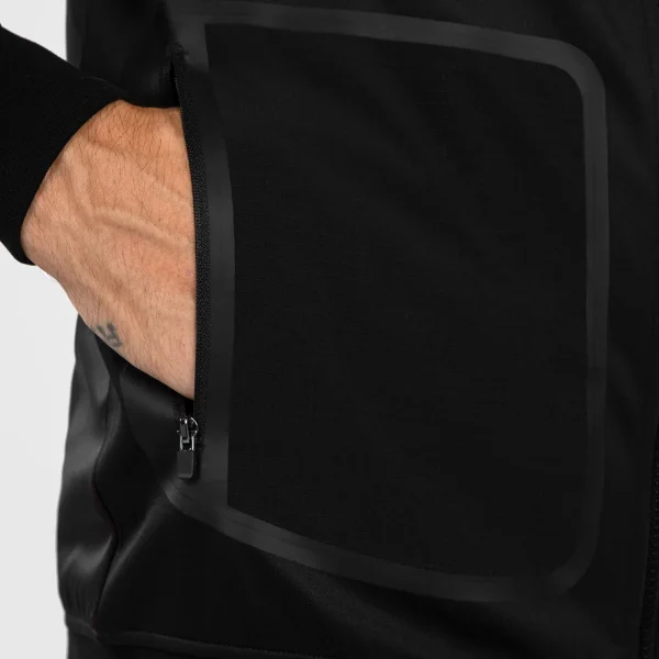 Man wearing a Venum x UFC Performance Institute 2.0 Men's Zip Up Hoodie