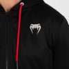 Man wearing Venum x UFC Performance Institute 2.0 Men's Zip Up Hoodie.