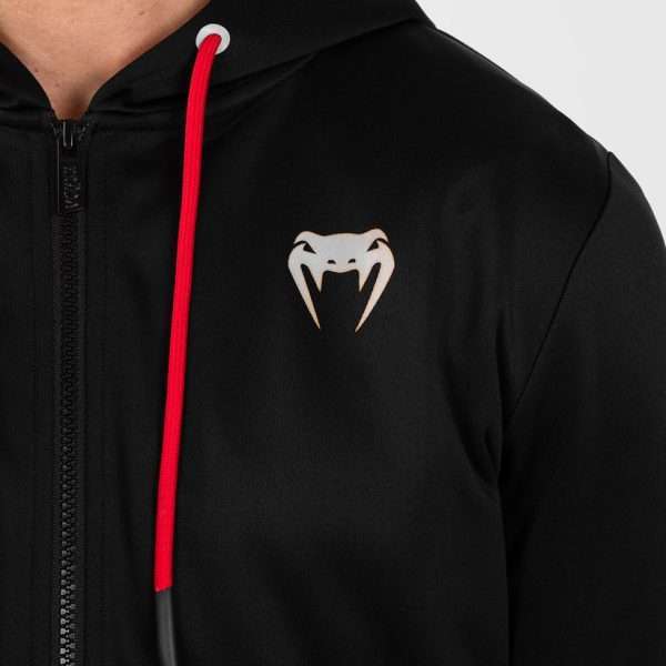 Man wearing Venum x UFC Performance Institute 2.0 Men's Zip Up Hoodie.