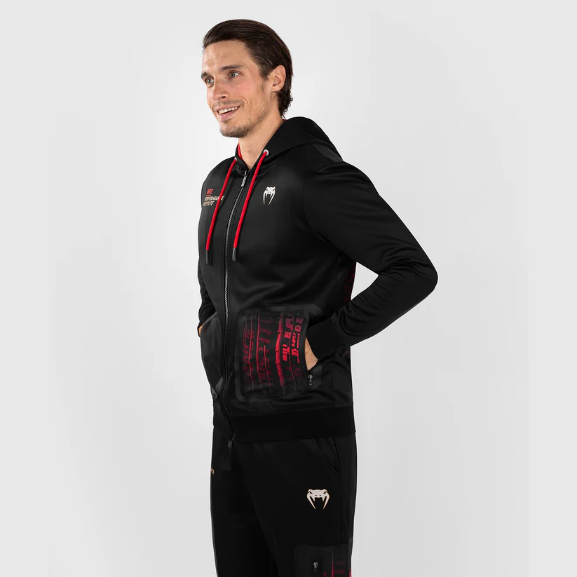 Man wearing Venum x UFC Performance Institute 2.0 Men's Zip Up Hoodie