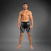 Man wearing Venum Attack Men's Vale Tudo Shorts