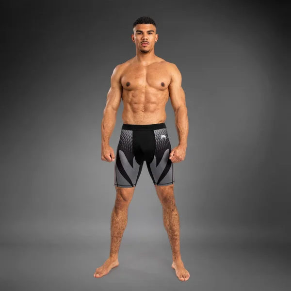 Man wearing Venum Attack Men's Vale Tudo Shorts
