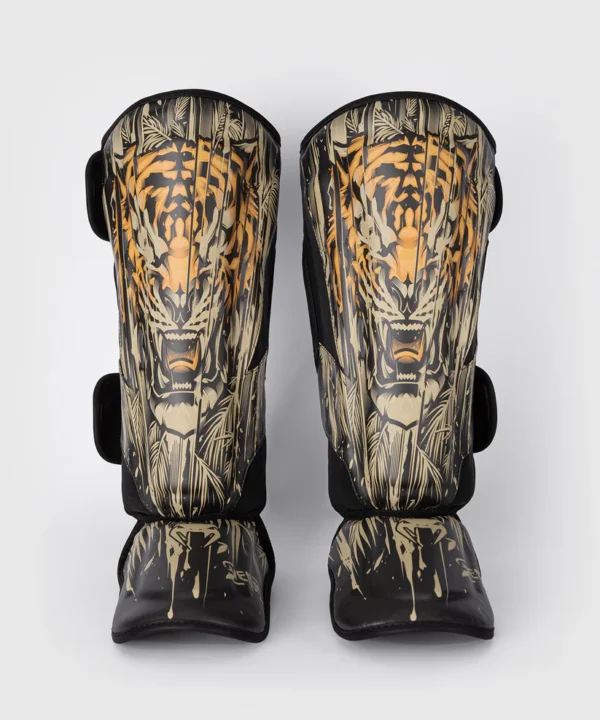 Venum Tiger Shin Guards on white background