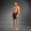 Man modeling Venum Attack Men's Vale Tudo Shorts