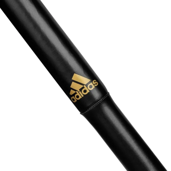 Two Adidas Striking Sticks laying on a white background