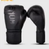 Child wearing Venum Kids Challenger 2.0 Boxing Gloves