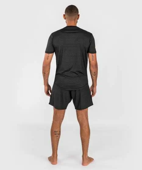 Man wearing a Venum x Ares 2.0 Dry-Tech T-Shirt from the sportswear collection
