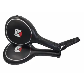 Professional Boxing Training with Pro-Box Elite Punch Paddles. Two Pro-Box Elite Punch Paddles in a professional gym environment.