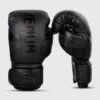 Child wearing Venum Kids Elite Boxing Gloves