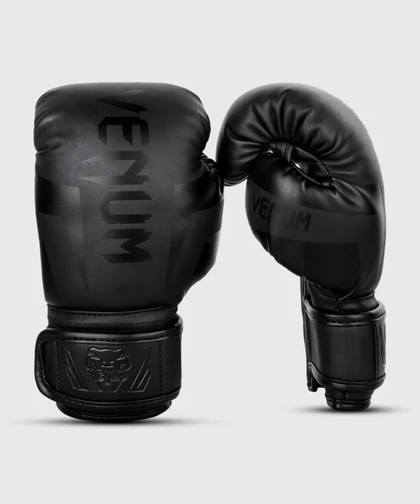 Child wearing Venum Kids Elite Boxing Gloves
