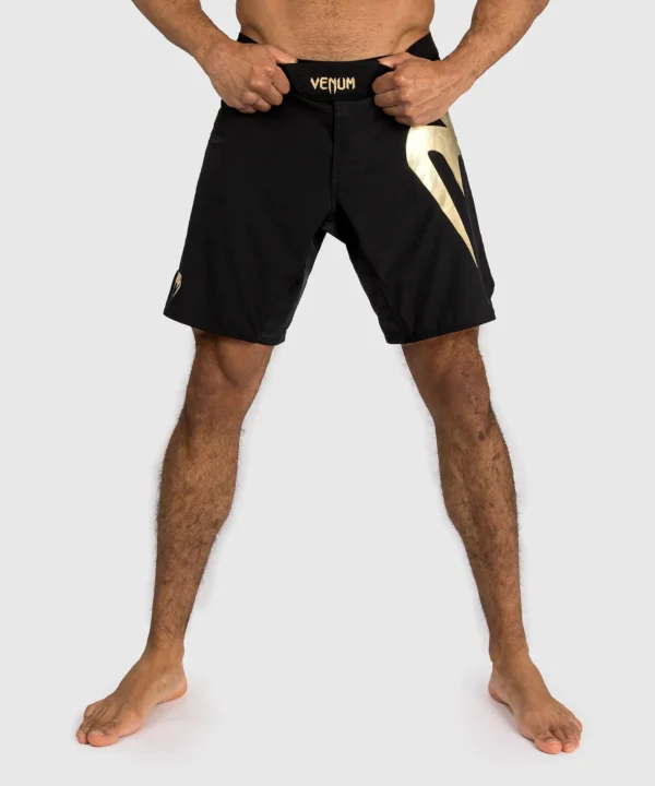 Venum Light 5.0 Fight Shorts in black and orange color.