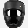 Venum Impact Evo Headgear Protection In Action Athlete preparing for combat sport with Venum Impact Evo Headgear Head Guard